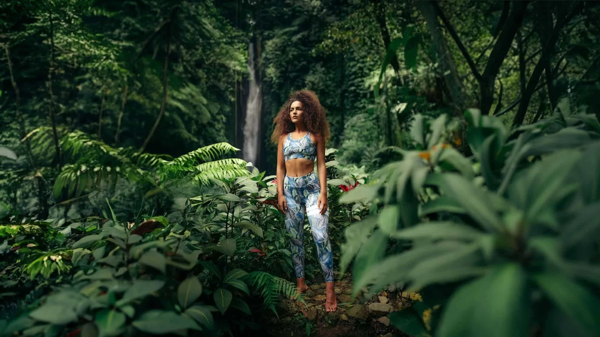 young woman wearing sport-wear in the middle of Bali's Jungle